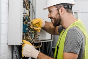 electrician repairing electrical box